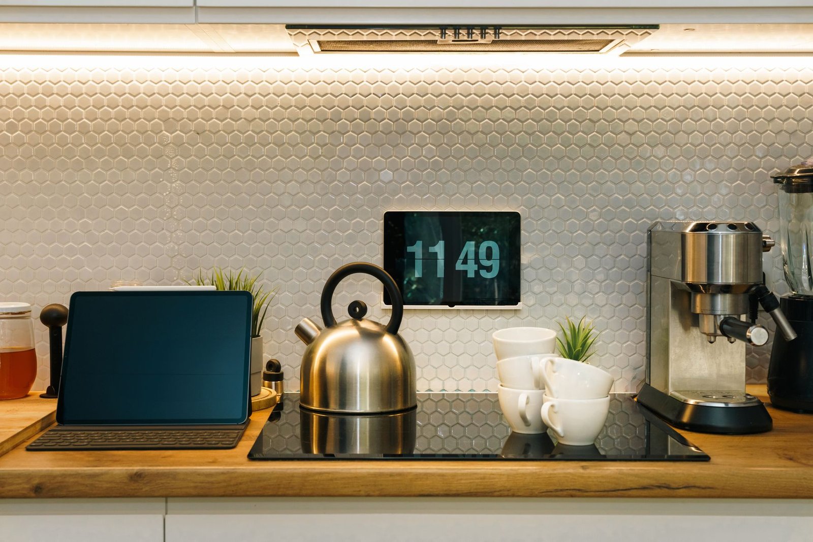 Modern smart kitchen counter with connected home appliances and digital controls.
